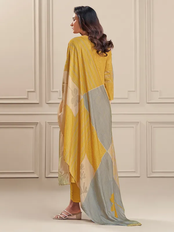 Yellow thread worked salwar suit in linen cotton