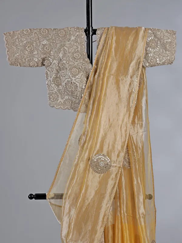 Yellow tissue silk saree with festive glow