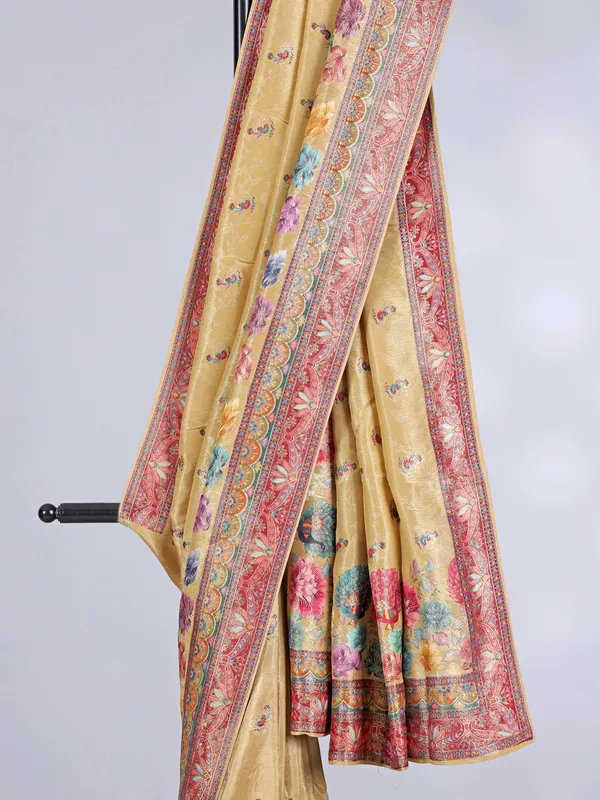 Yellow tissue silk saree with floral print and contrast border