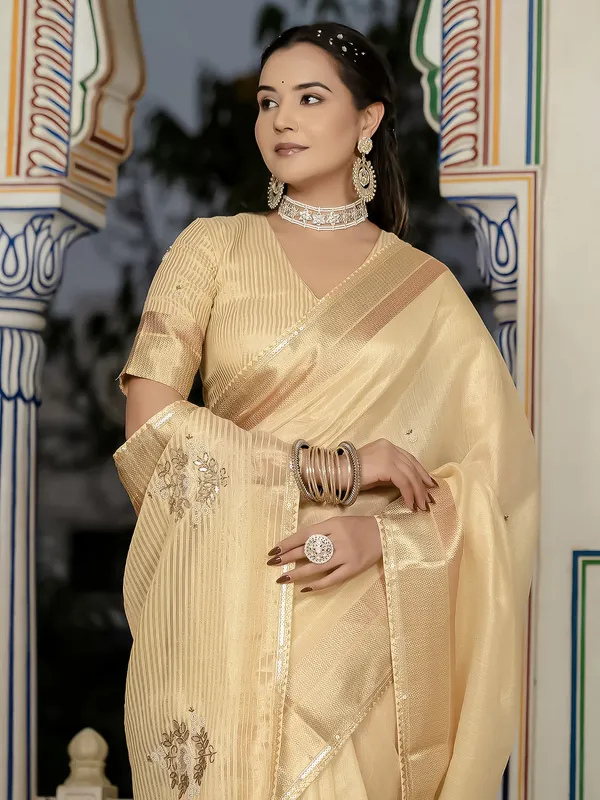 Yellow tissue silk saree with unstitched blouse