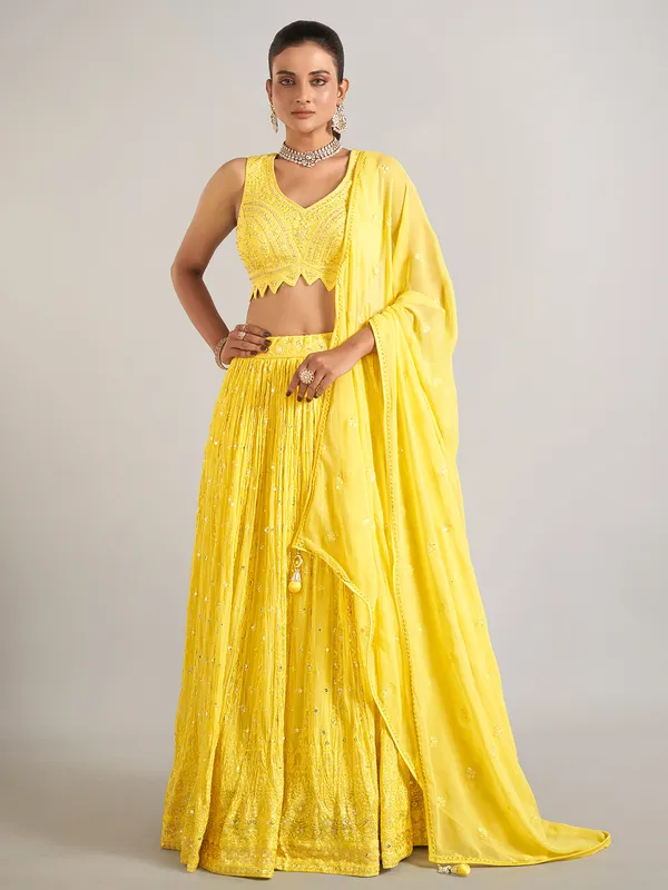 Yellow wedding wear lehenga choli in soft georgette