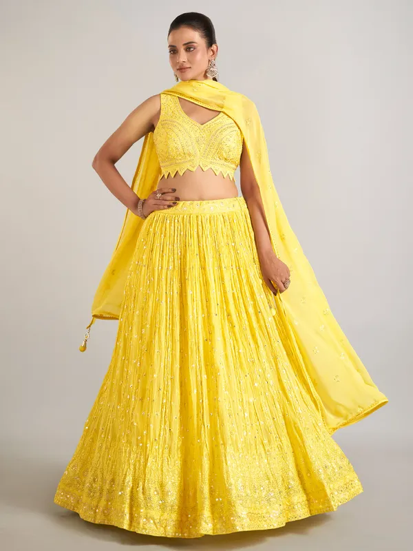 Yellow wedding wear lehenga choli in soft georgette