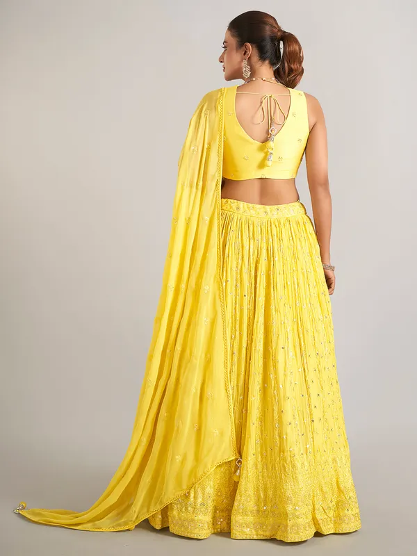 Yellow wedding wear lehenga choli in soft georgette