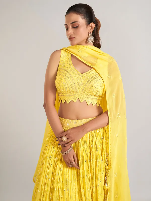 Yellow wedding wear lehenga choli in soft georgette