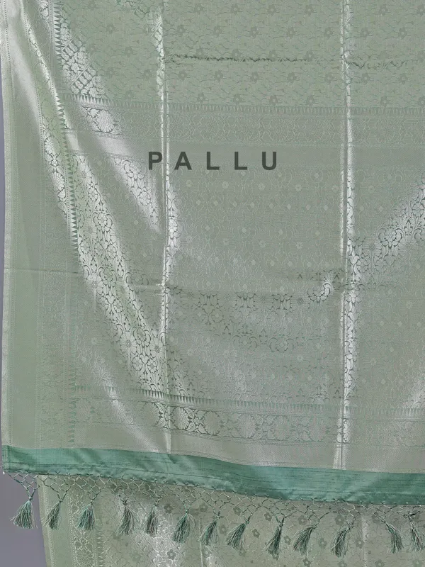 Pista green silk saree with zari weaving