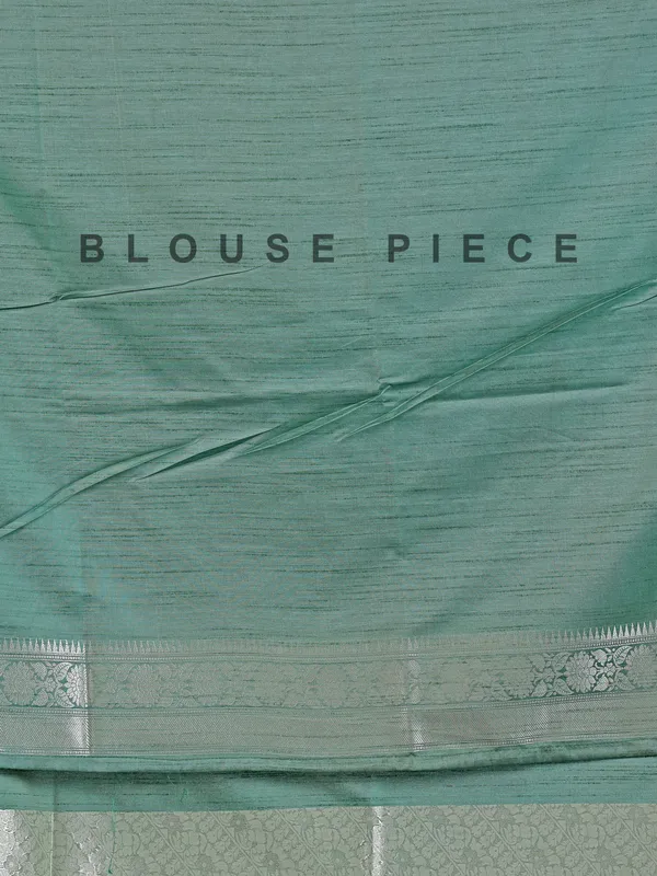 Pista green silk saree with zari weaving