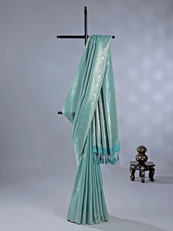 Sage green silk saree with subtle zari highlights