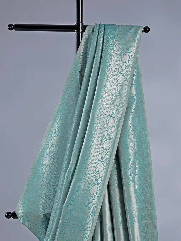 Sage green silk saree with subtle zari highlights