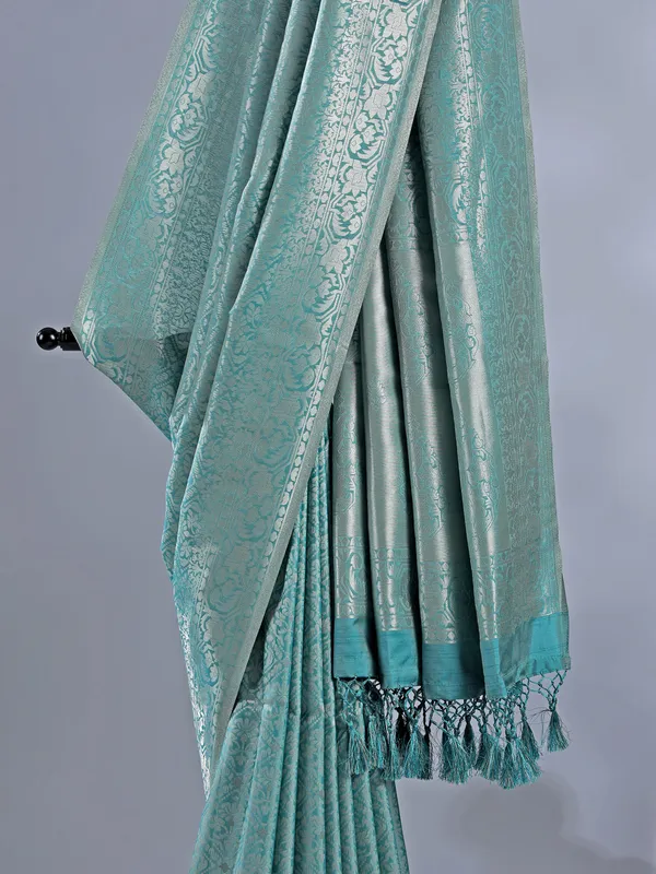 Sage green silk saree with subtle zari highlights