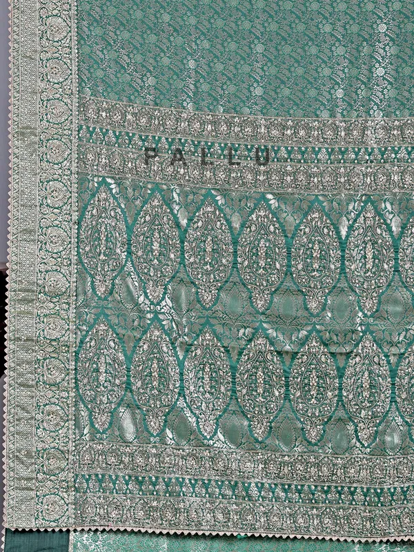 Green kanjivaram saree with wedding embellishments
