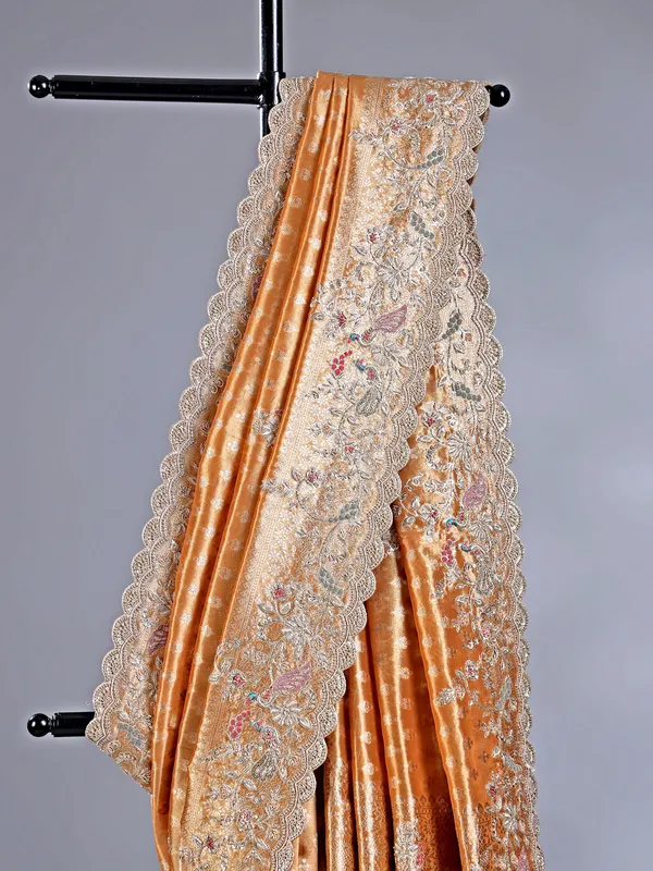 Pastel orange shimmer saree with festive glow