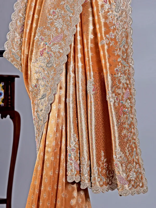Pastel orange shimmer saree with festive glow