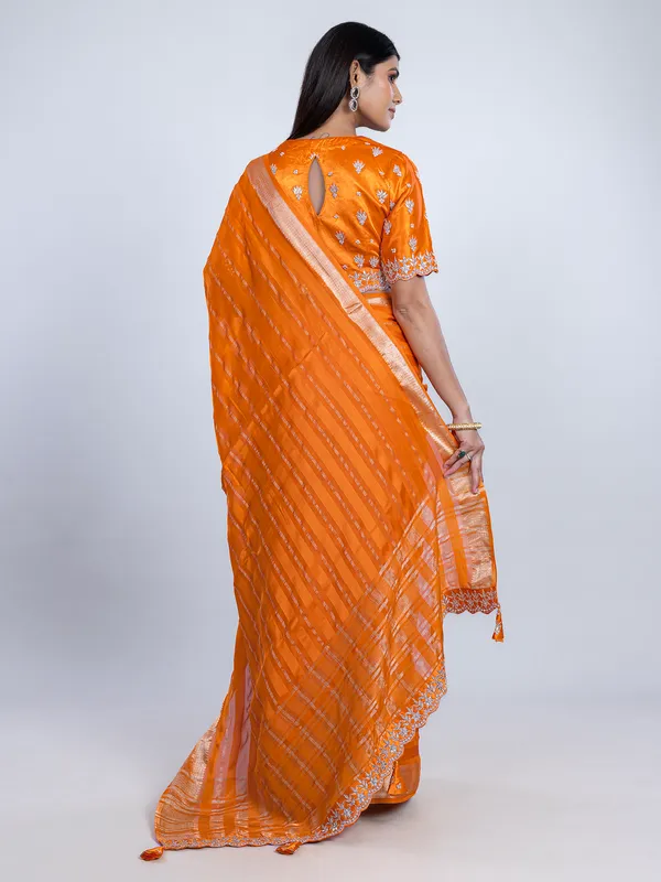 Orange organza satin saree with stone studded blouse