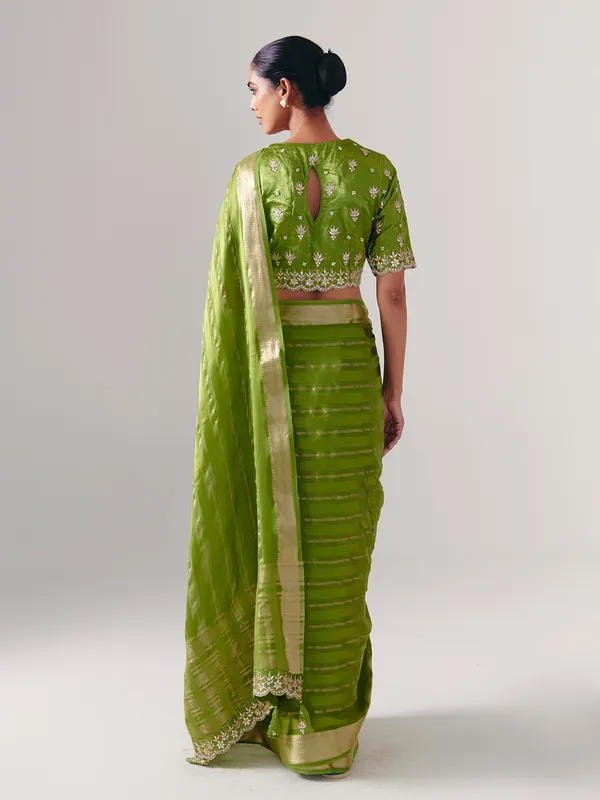 Green silk saree with heavy festive blouse