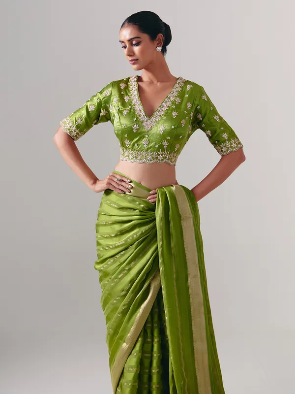 Green silk saree with heavy festive blouse