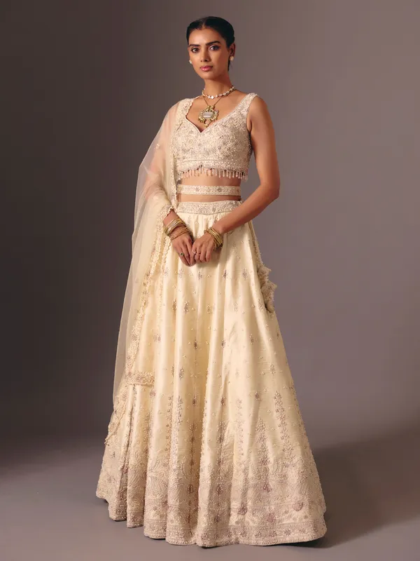 Cream raw silk bridal lehenga choli with sequins work