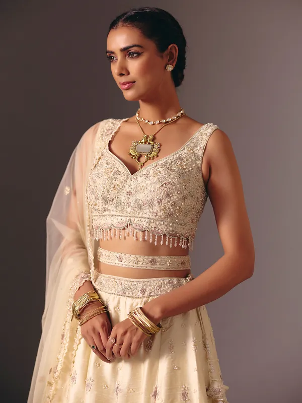 Cream raw silk bridal lehenga choli with sequins work