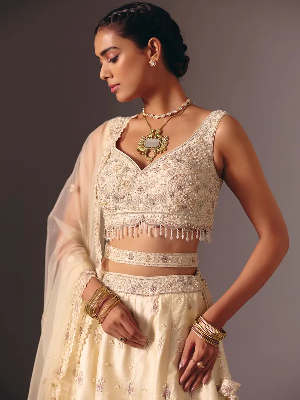 Cream raw silk bridal lehenga choli with sequins work