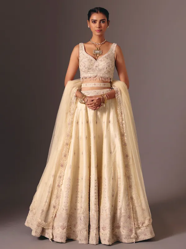 Cream raw silk bridal lehenga choli with sequins work