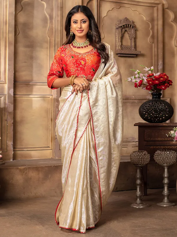 Stylish cream tissue silk saree for wedding