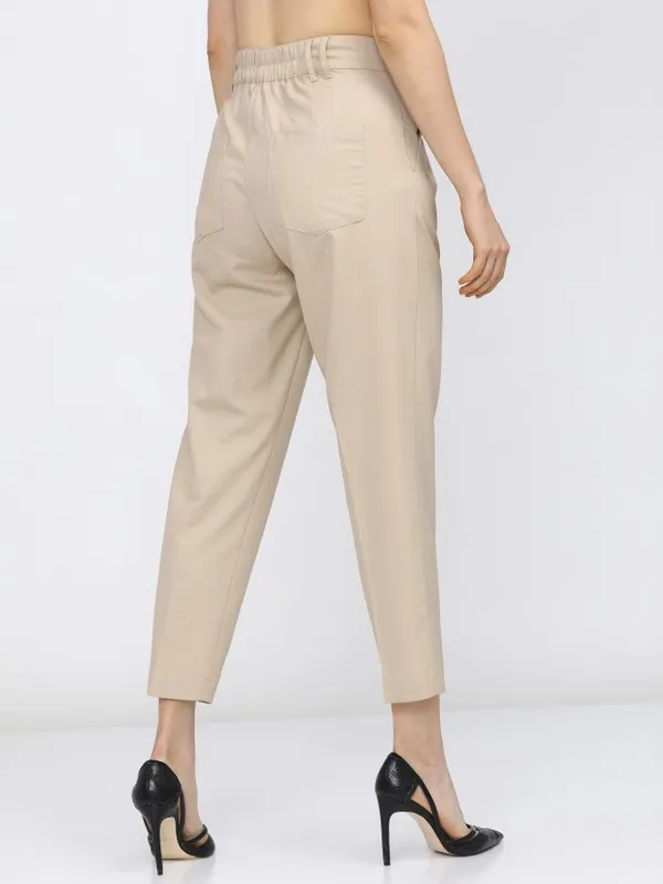  Tokyo Talkies Women Beige Solid Tapered Fit Casual Trousers