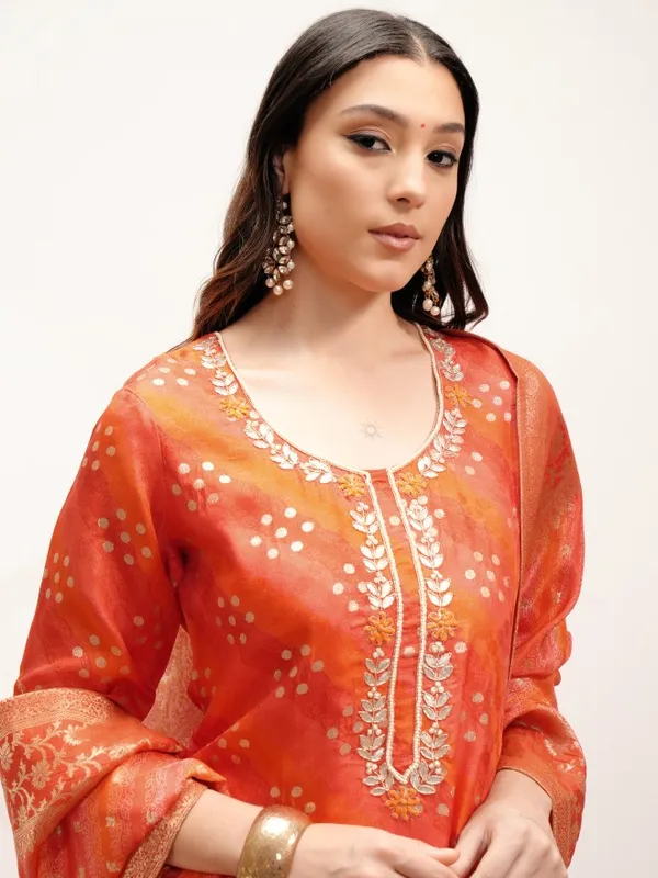 Vishudh Women Orange Embroidered Kurta With Trouser And Dupatta