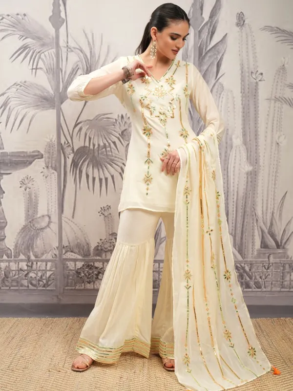 Vishudh Women Cream Embroidered Kurta With Sharara And Dupatta