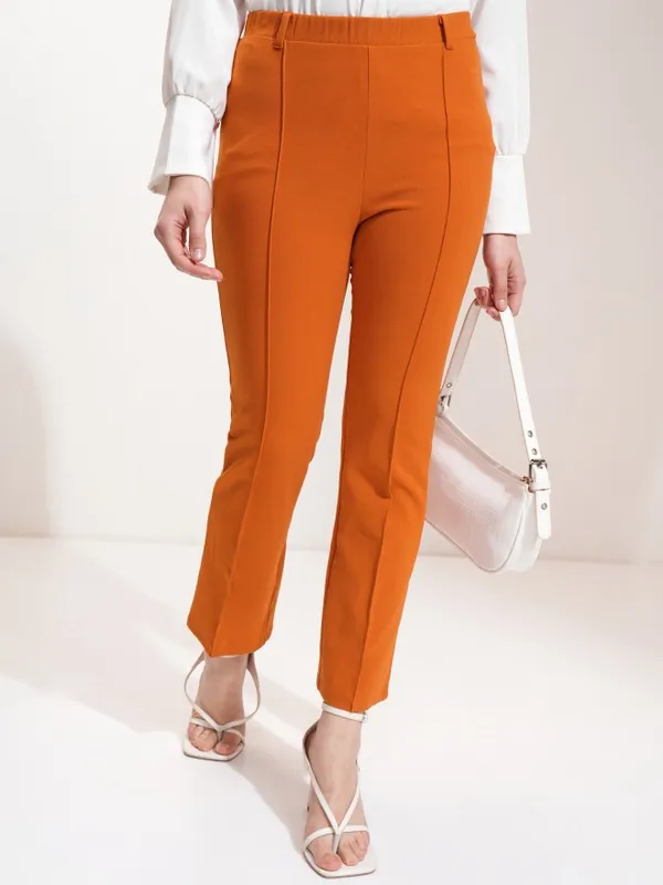 Tokyo Talkies Women Rust Flared Solid Trousers