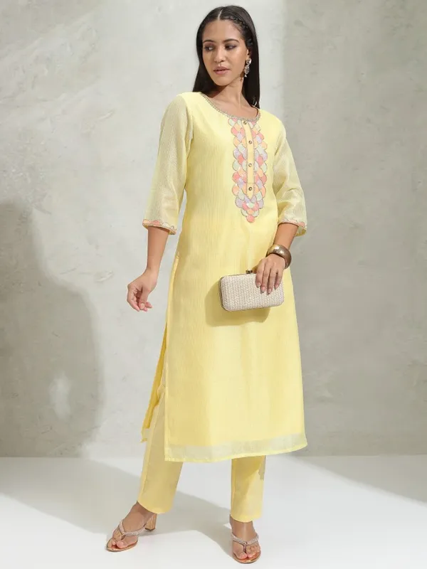 Vishudh Women Yellow Solid Regular Round Neck Kurta With Neck Patch Three Quarter Sleeves And Slim Pants 