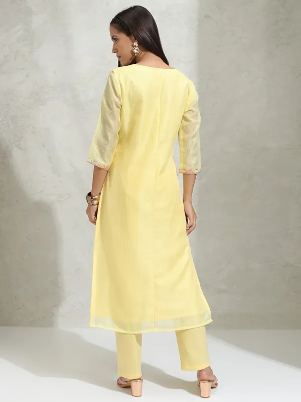 Vishudh Women Yellow Solid Regular Round Neck Kurta With Neck Patch Three Quarter Sleeves And Slim Pants 