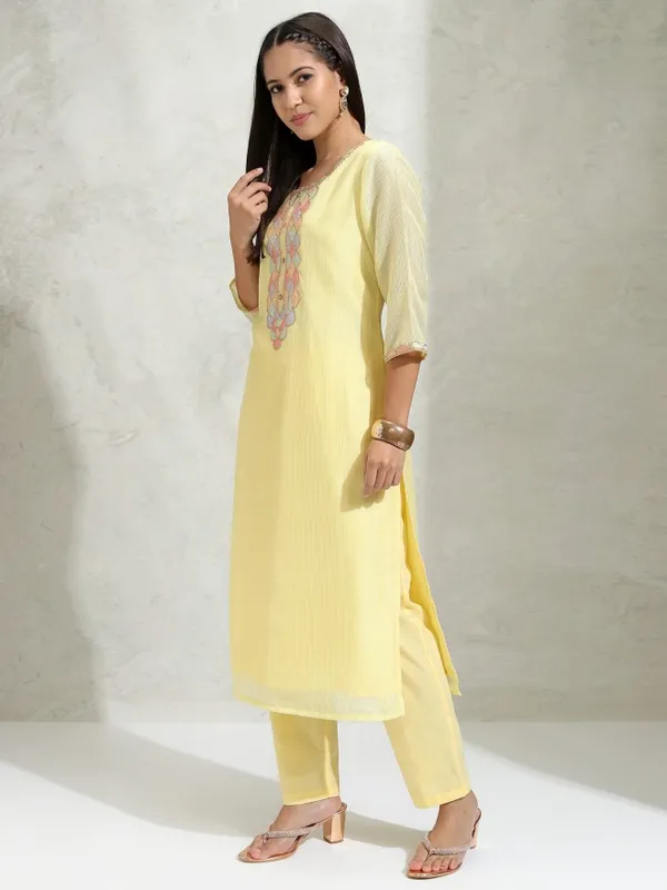 Vishudh Women Yellow Solid Regular Round Neck Kurta With Neck Patch Three Quarter Sleeves And Slim Pants 