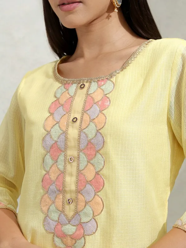 Vishudh Women Yellow Solid Regular Round Neck Kurta With Neck Patch Three Quarter Sleeves And Slim Pants 