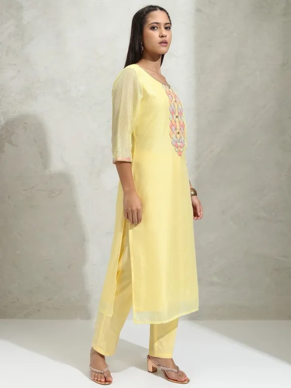 Vishudh Women Yellow Solid Regular Round Neck Kurta With Neck Patch Three Quarter Sleeves And Slim Pants 