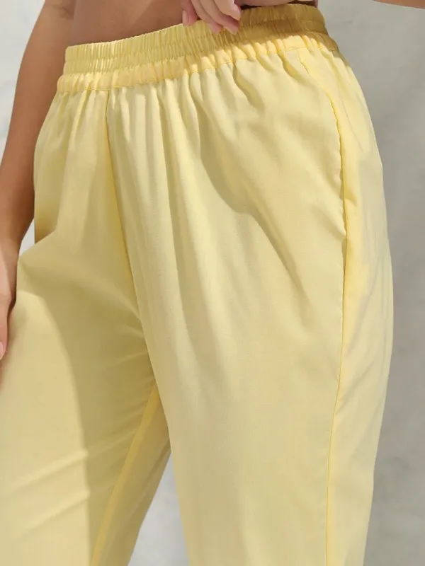 Vishudh Women Yellow Solid Regular Round Neck Kurta With Neck Patch Three Quarter Sleeves And Slim Pants 