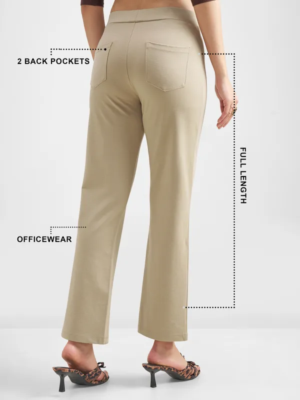 Tokyo Talkies Women Tan Solid Bootcut Regular Trouser