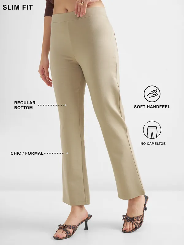 Tokyo Talkies Women Tan Solid Bootcut Regular Trouser