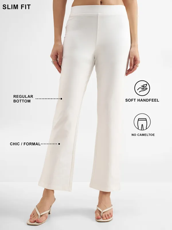 Tokyo Talkies Women White Solid Bootcut Regular Trouser