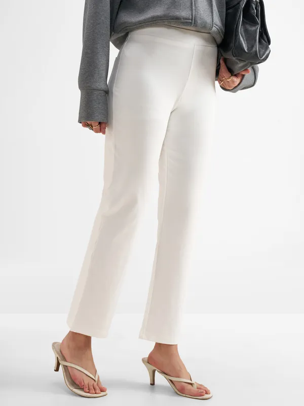 Tokyo Talkies Women White Solid Bootcut Regular Trouser