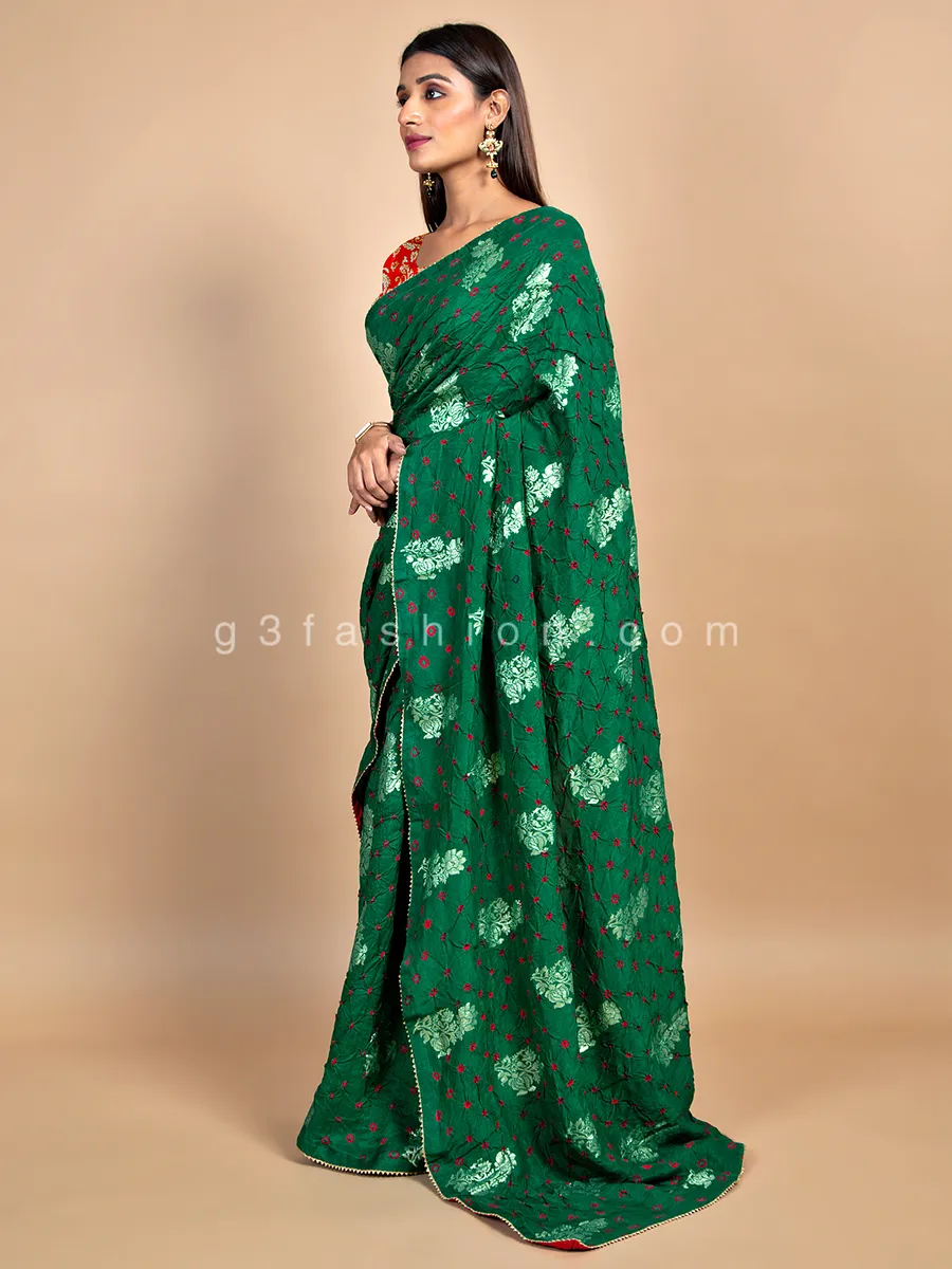 Amazing bandhej dark green saree for wedding