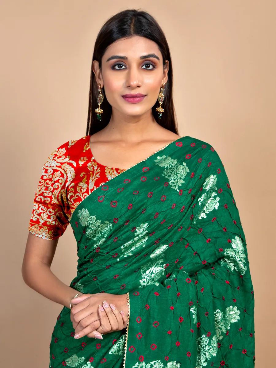 Amazing bandhej dark green saree for wedding