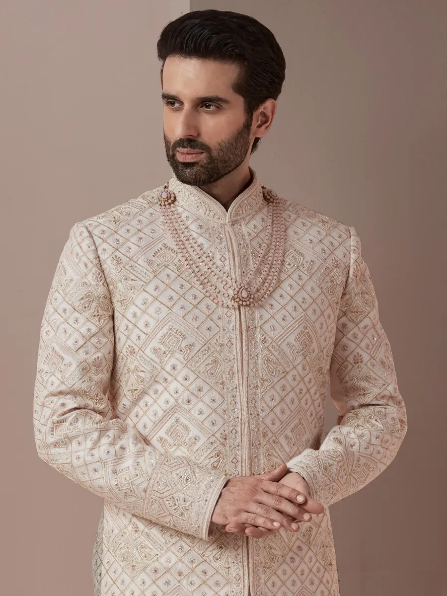 Baby pink lavish groom wear sherwani in raw silk