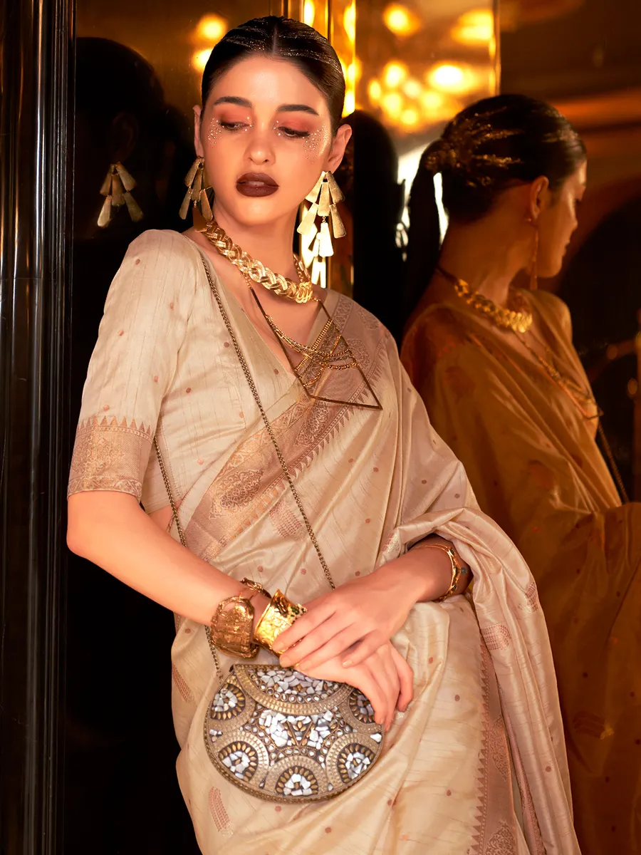 Beige tusser silk saree with zari weaving