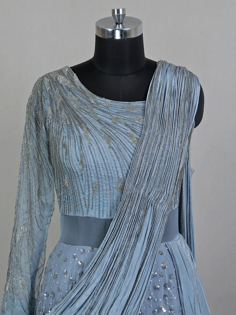 Blue net floor length gown with draped odhani pattern