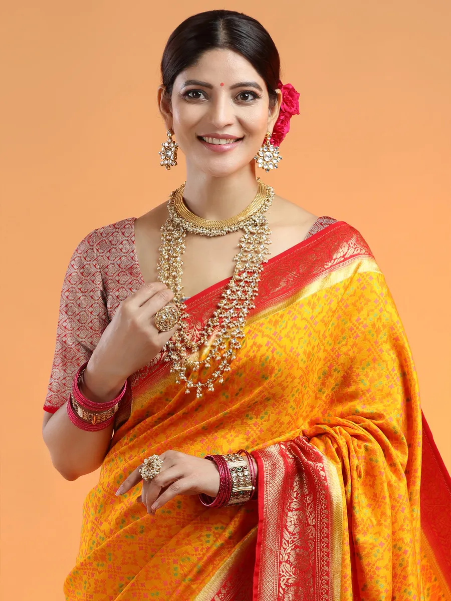 Bright yellow extravagant wedding look saree in silk