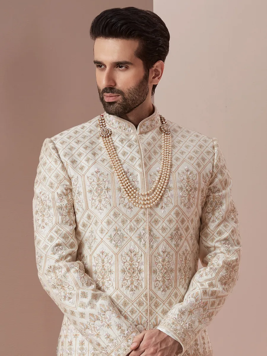 Cream and green raw silk groom wear sherwani