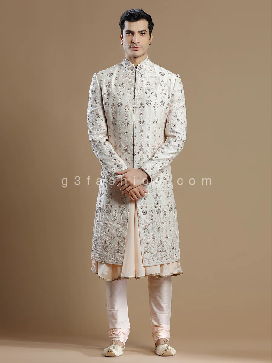 Cream and peach raw silk groom wear sherwani