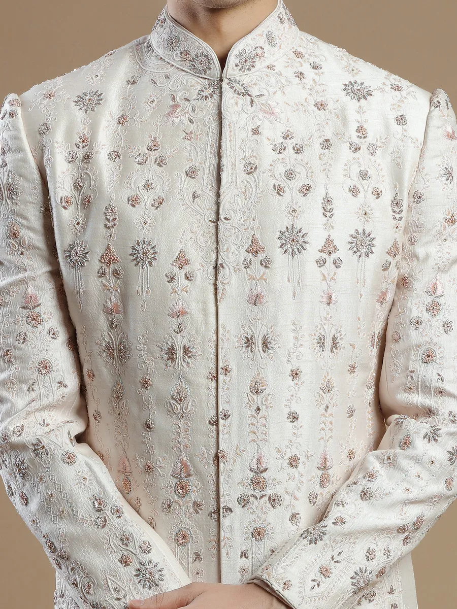 Cream and peach raw silk groom wear sherwani