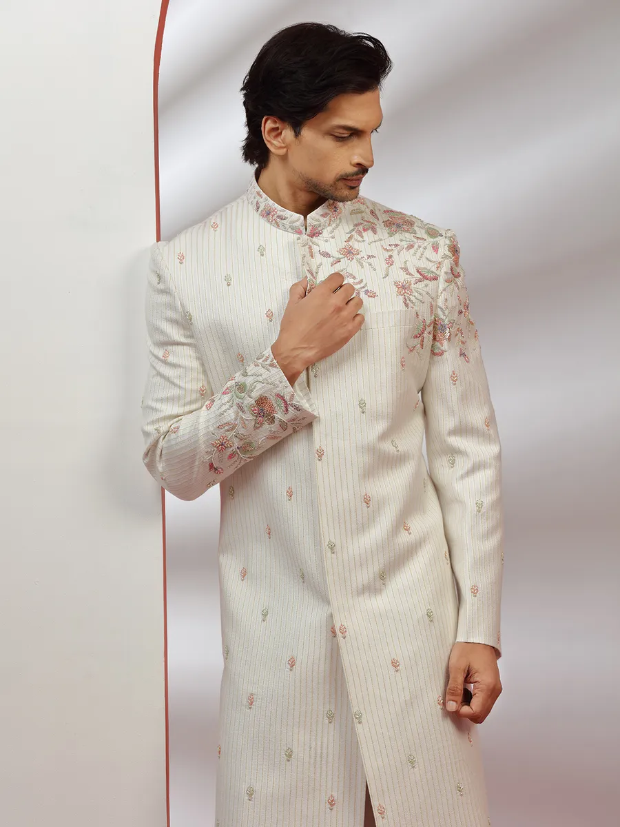 Cream hue raw silk groom wear sherwani