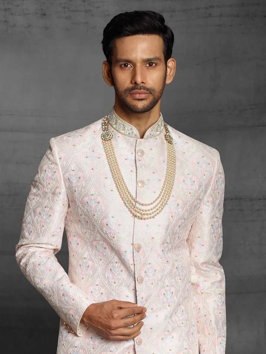 Cream hue raw silk sherwani for wedding event