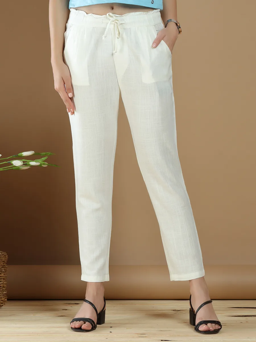 Cream hued linen casual wear plain pant